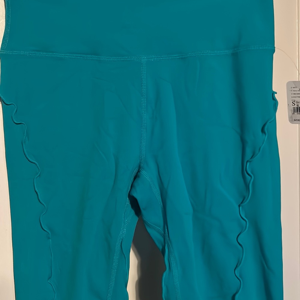 NWT free People, movement teal wavy waters ruffle leggings